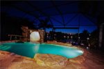 Gorgeous view of the grotto and electrically heated pool at night